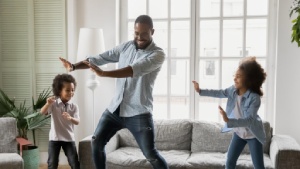 African American family dancing in living room-Winter Comfort System Health Tips-Allgeier Air-Louisville-300x169