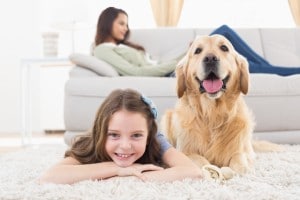 girl with her dog on floor and mom on couch in background-furnace repair-Allgeier Air-Louisville Ky