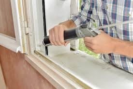 Man caulking window-Allgeier Air-Louisville KY-275x183