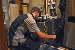 Allgeier Air tech working on AC-Allgeier Air- Save Money On A New AC And Furnace-Louisville KY-300x200jpg