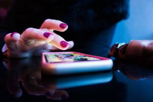 Finger on a cell phone-Smart Home Heating and Cooling-Allgeier Air-Louisville KY-300x200jpg