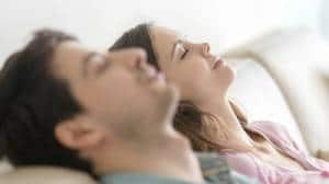 Young couple comfortable on couch-Benefits of a Humidifier-Allgeier Air-Louisville KY-300x168jpg