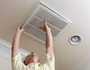Man changing air filter-Allgeier Air-Louisville KY-300x235jpg