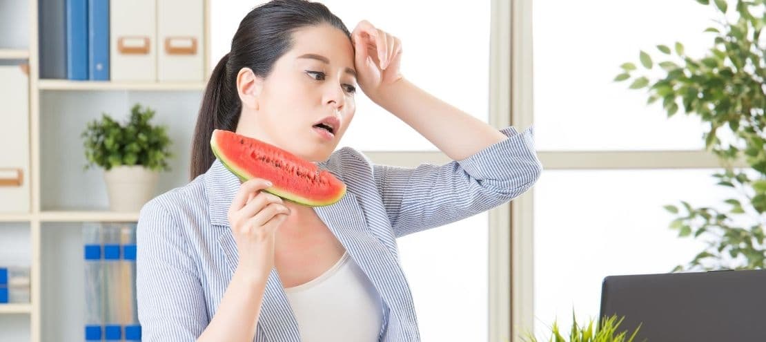 Asian girl cooling off by eating watermelon-Allgeier Air-Louisville KY-600x315jpg