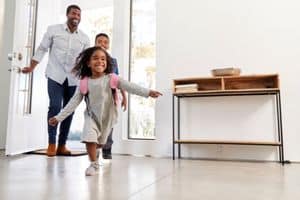 Happy young student running into house - HVAC Tips To Avoid AC Repair For The School Year-Allgeier Air-Louisville KY-300x200jpg 