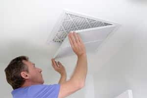 Man changing air filter-Allgeier Air-Louisville KY-300x200jpg 