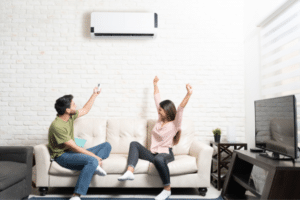 Couple on couch with mini split unit-Where Can You Install A Mini Split Unit-Allgeier Air-Louisville KY-600x400jpg 