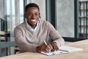 Guy at desk-Questions To Ask When Considering A New Air Conditioner-Allgeier Air-Louisville KY-600x400jpg